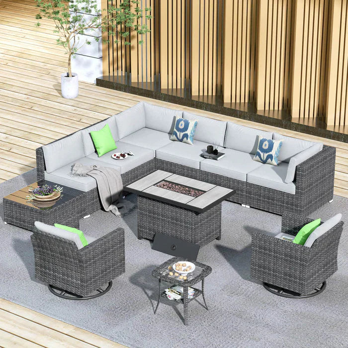 The Ovios gray wicker L-shaped sectional with fire pit table and swivel chairs creates a stylish lounge on the modern wooden deck