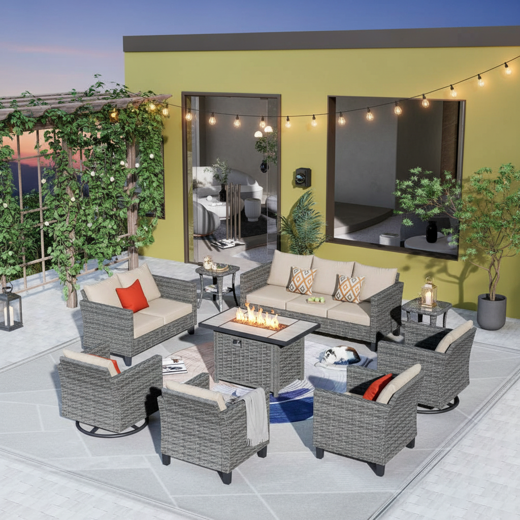 An evening patio with a fire pit table centered among modular sectional seating arranged safely around it.