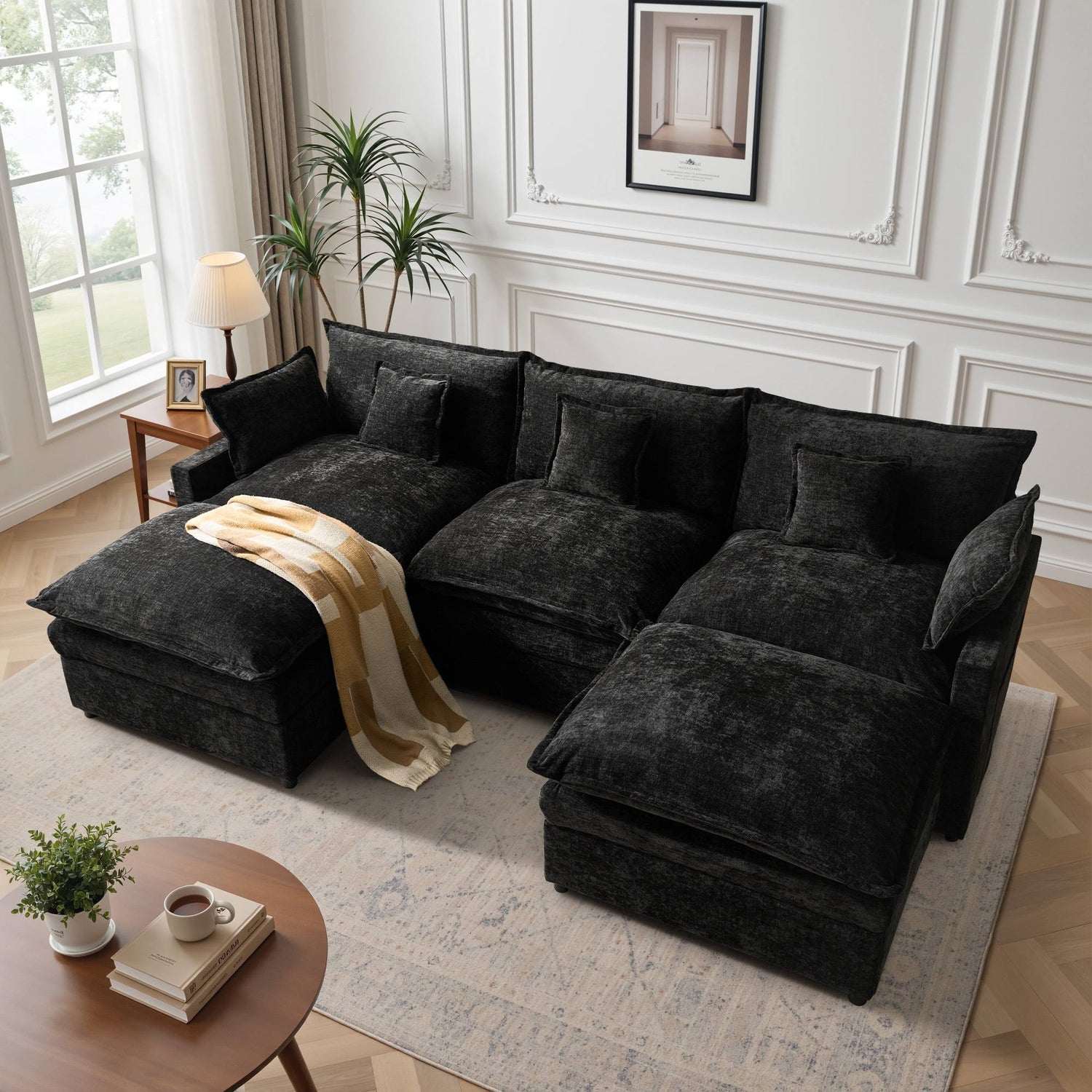 Ovios black modular foam sofa set configured as a cozy reading nook within a modern family living room