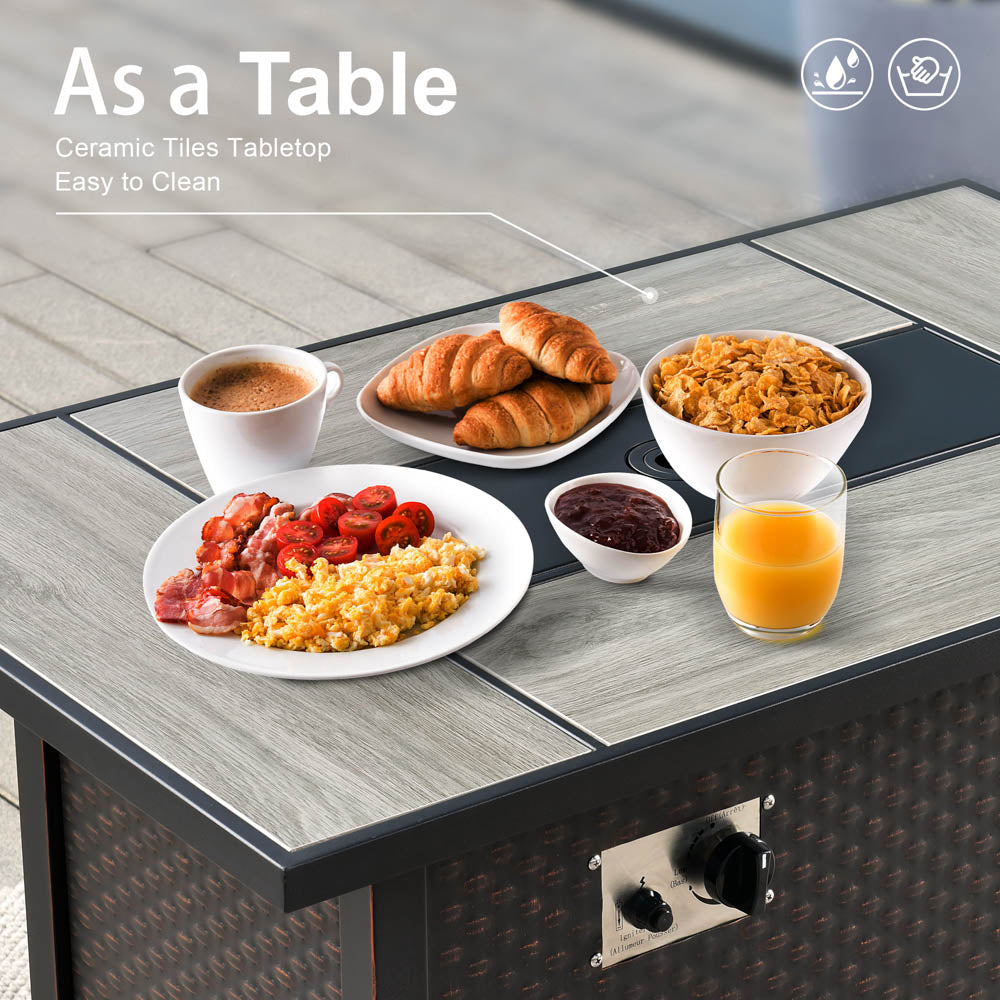 Ovios 42'' rectangle brown propane fire pit table with ceramic tile top, used as a dining table.