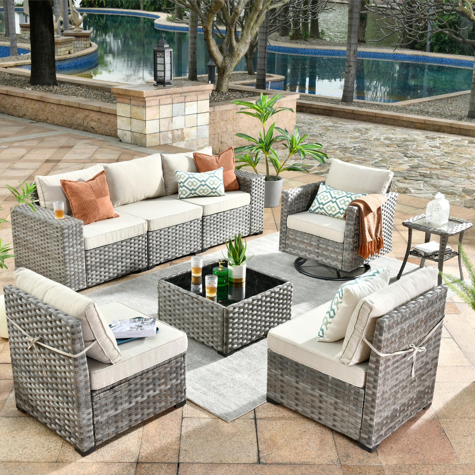 Beige Ovios 8-piece outdoor modular sectional sofa set with all-weather wicker swivel chairs.