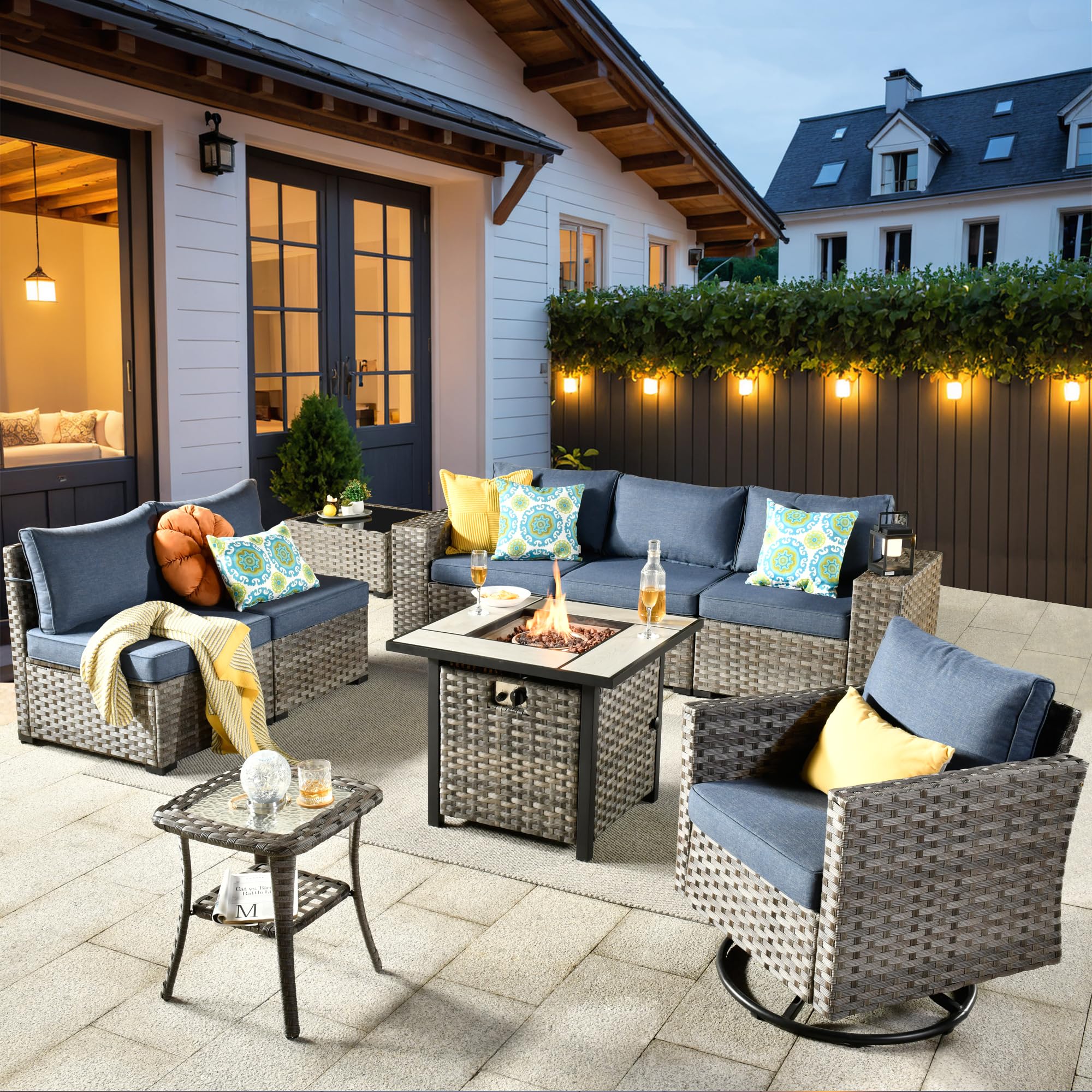 Denim Blue Ovios 9-piece all-weather rattan patio set: modular sofa, swivel chair, fire pit.