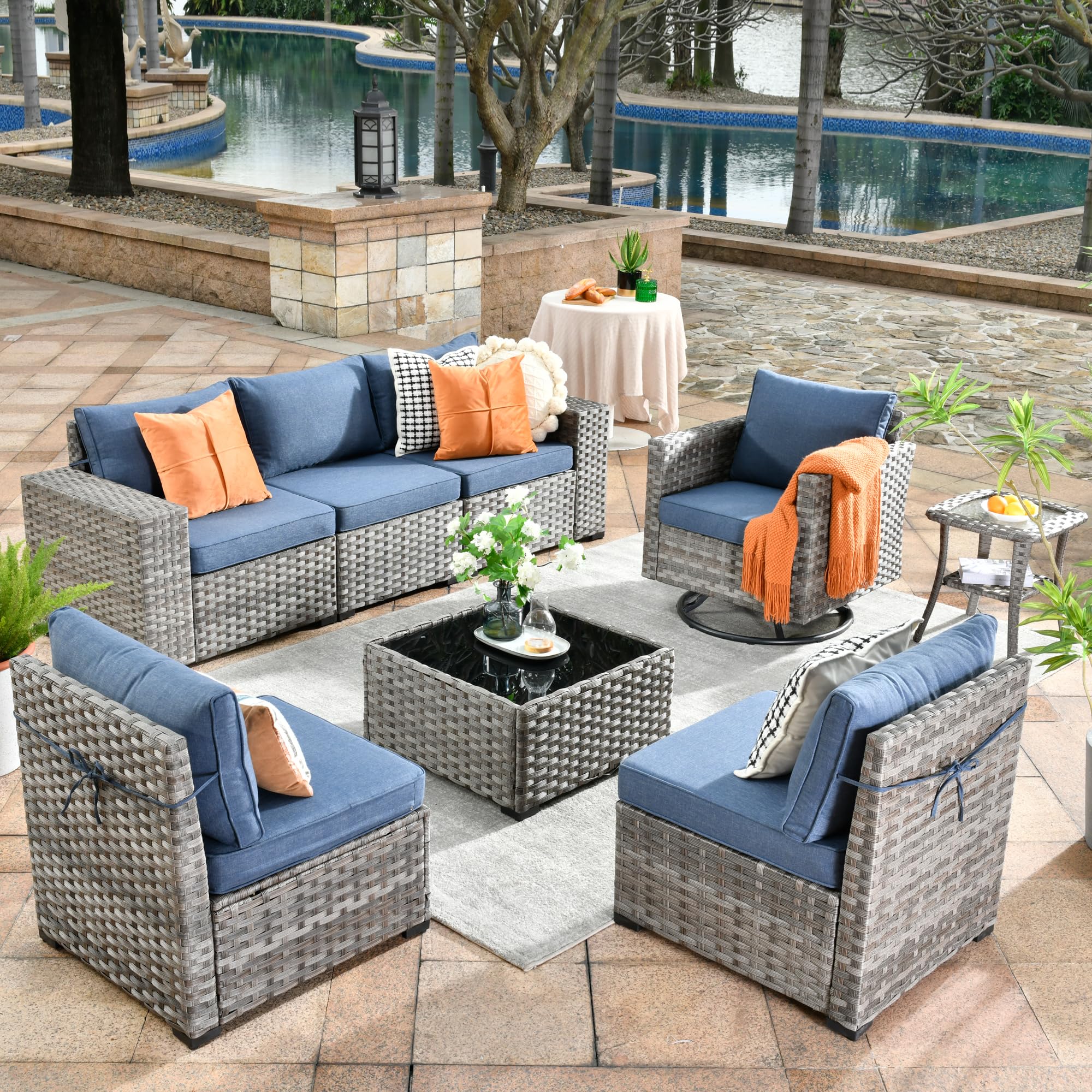 Denim Blue | Ovios 8-piece modular grey wicker sectional sofa with swivel chair.