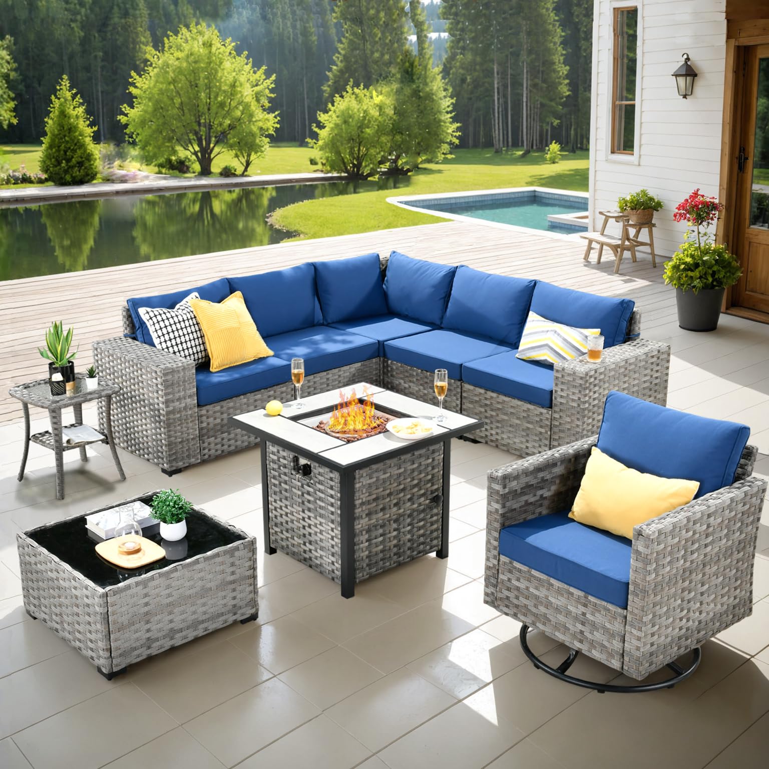 Navy Blue Ovios 9-piece grey rattan patio sectional sofa with blue cushions, swivel chair, and fire pit table.