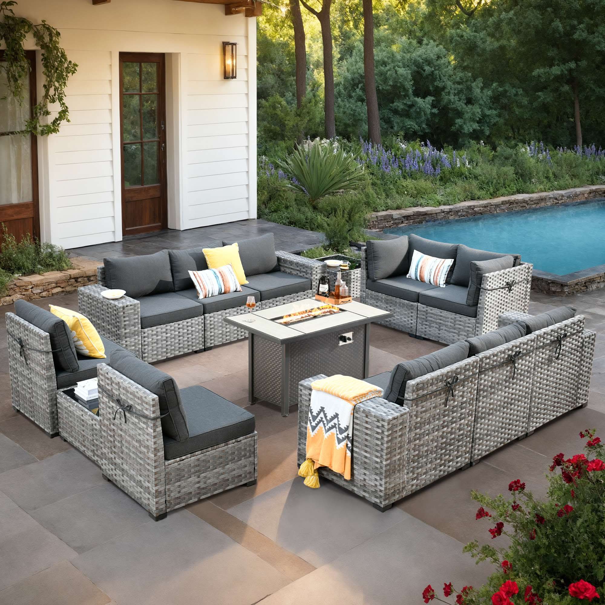 Black OVIOS grey rattan outdoor furniture set with fire pit table, armrest and rocking chairs.