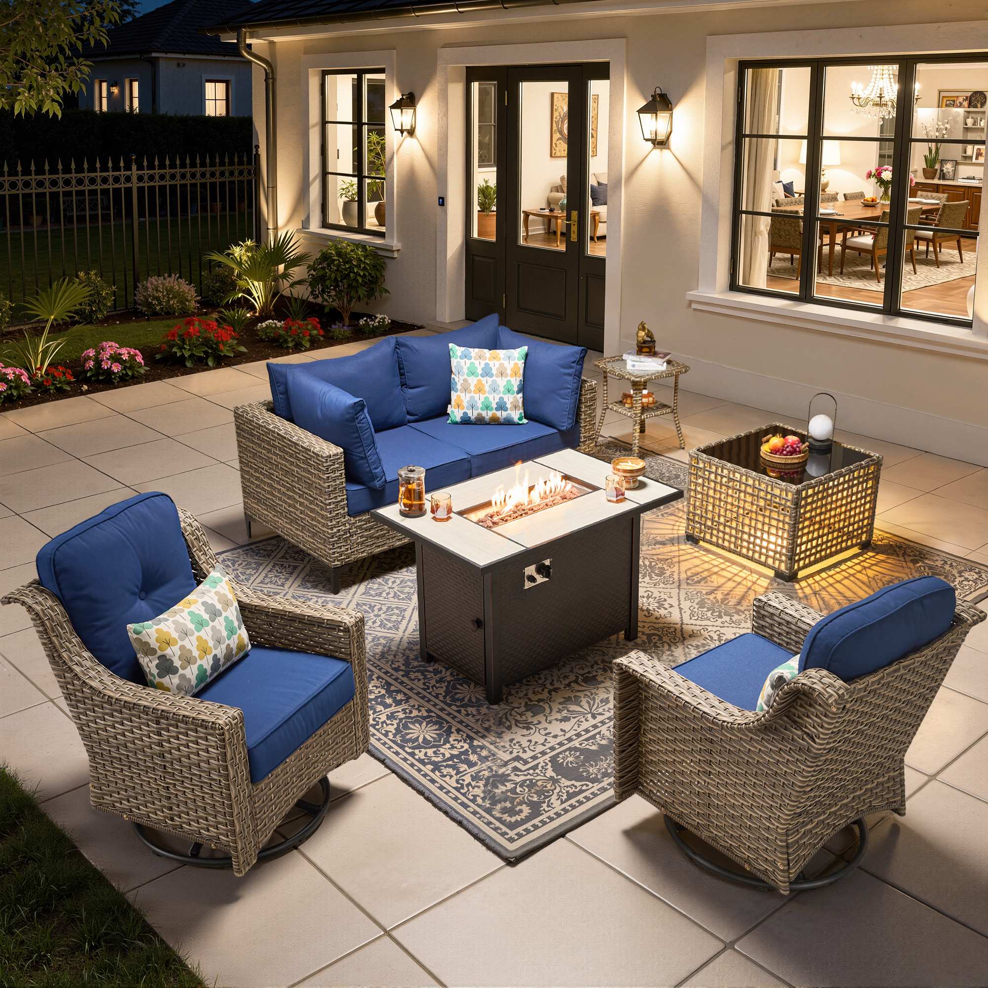 OVIOS wicker patio sectional set with fire pit table and swivel chairs featuring blue cushions.