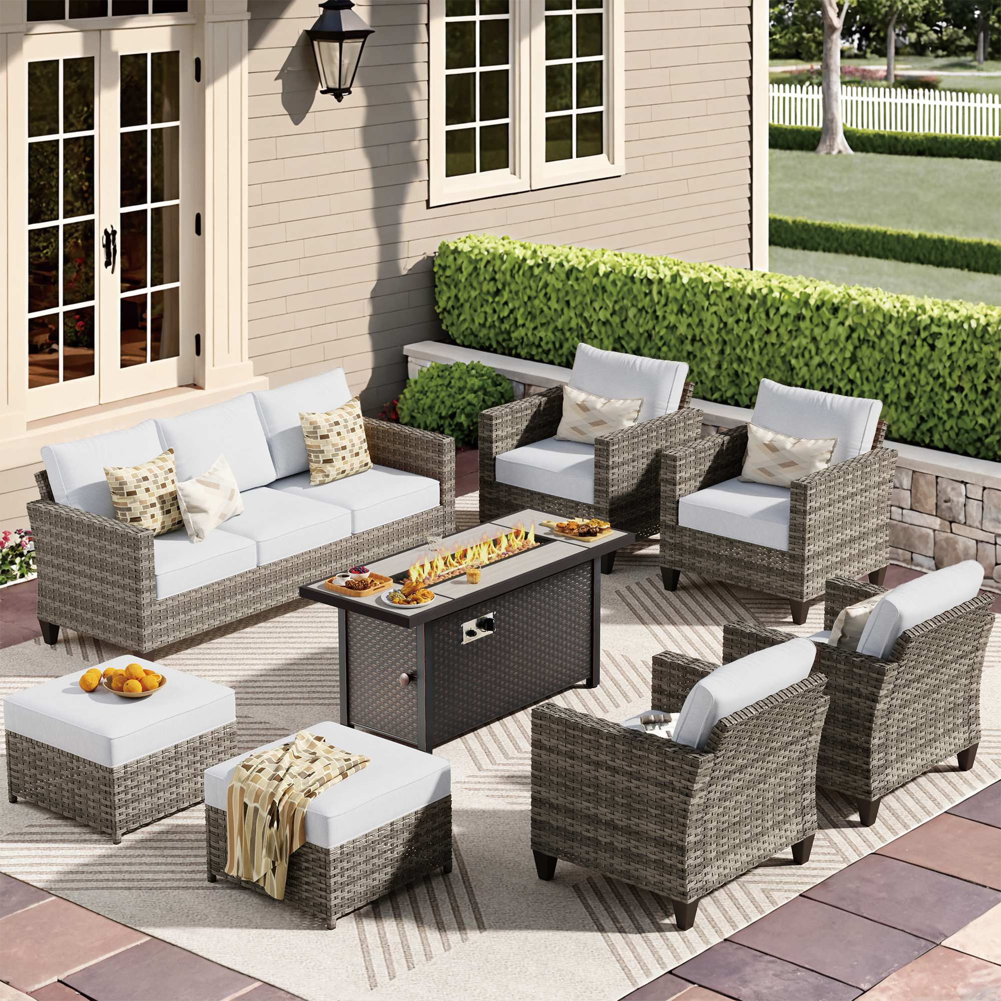 Light Grey |OVIOS wicker outdoor patio conversation set with fire pit table, sofa, chairs, and ottomans.
