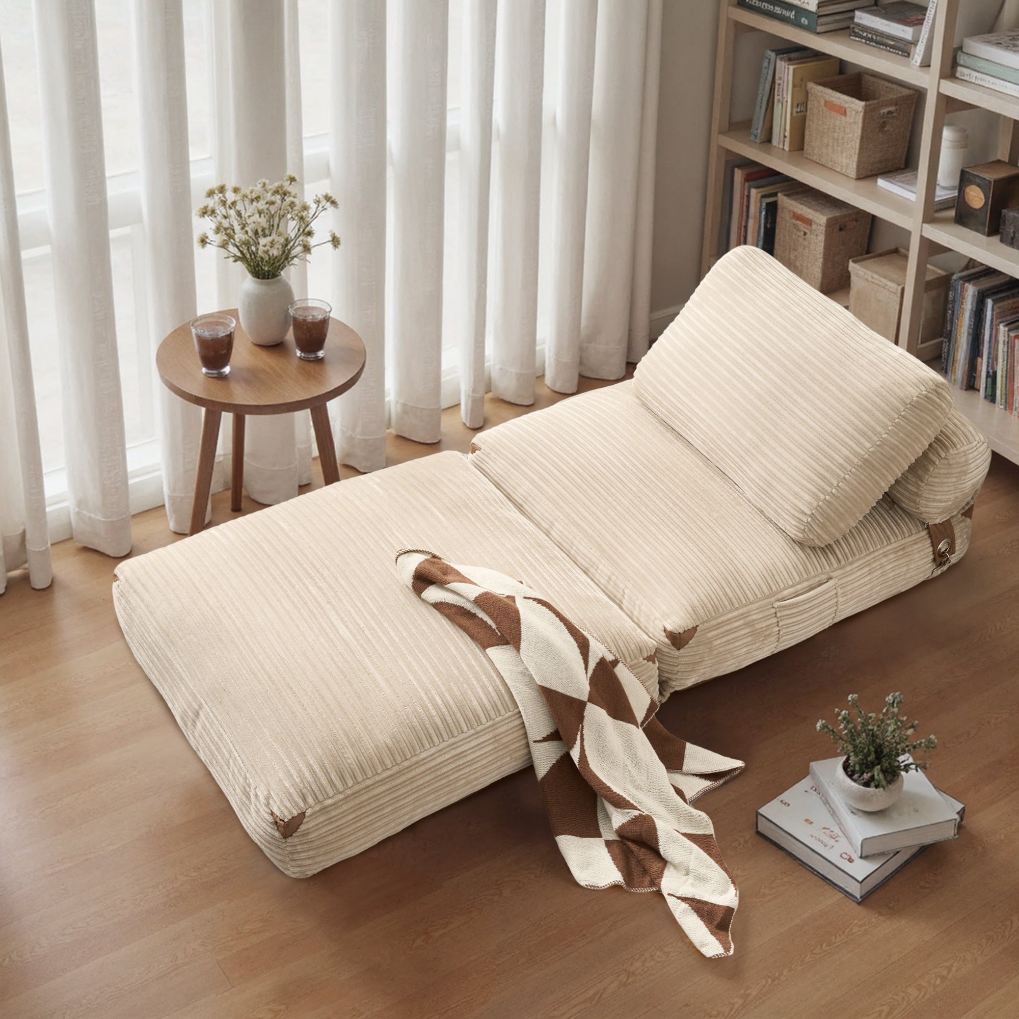 Ovios folding sofa bed in beige corduroy, perfect for small spaces and relaxation, with a cozy interior design.