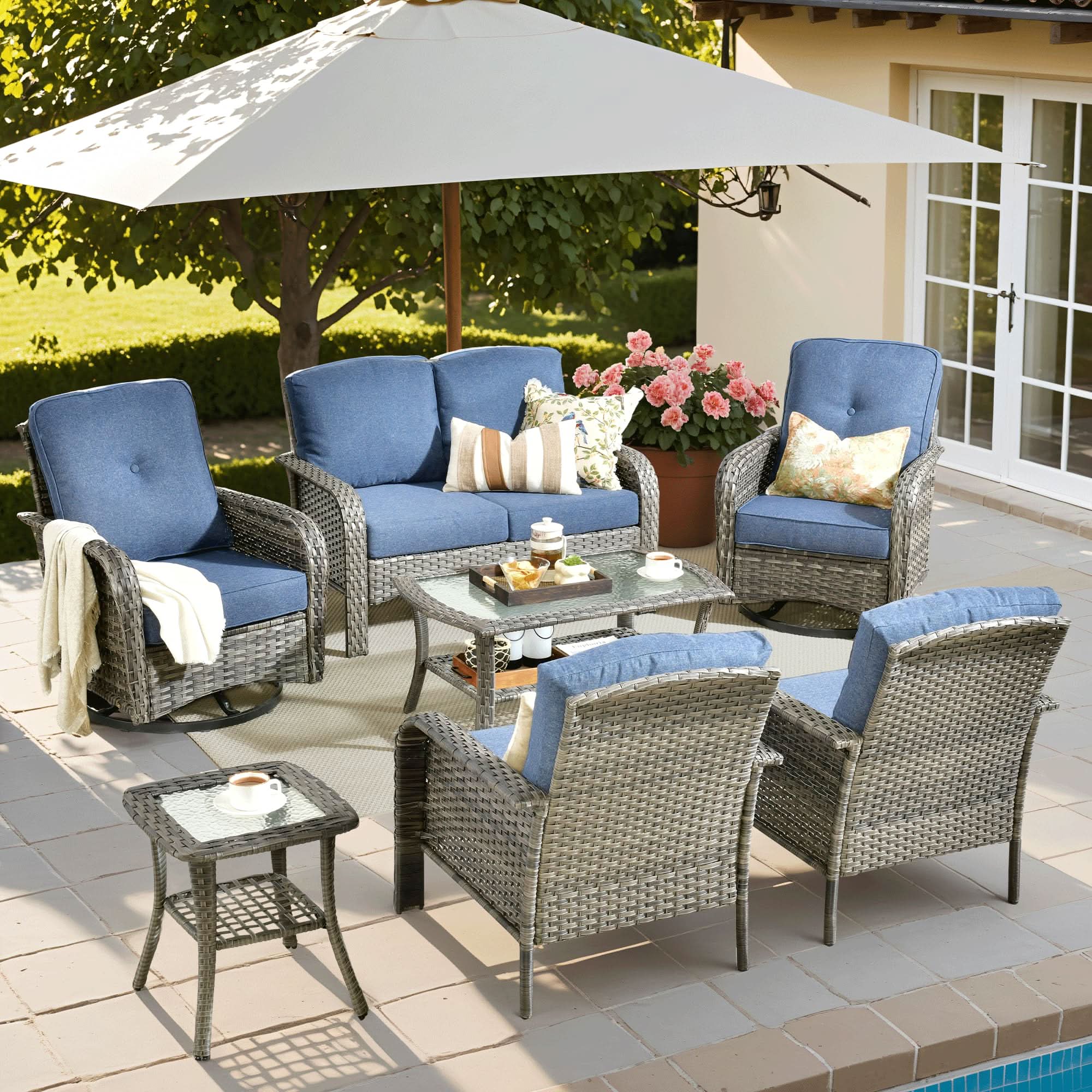 OVIOS 7-piece patio set with swivel chairs, gray wicker, blue cushions, and a glass coffee table