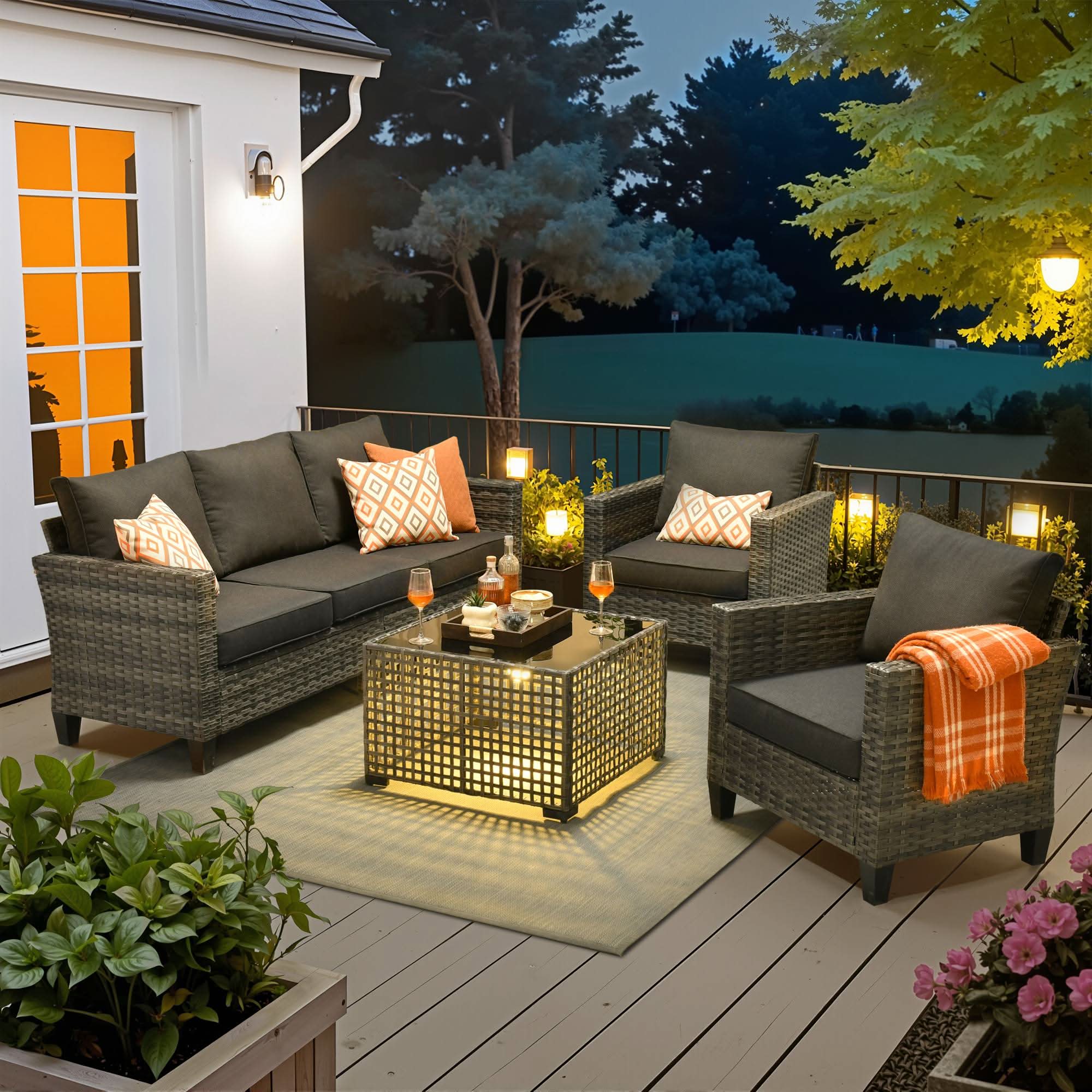 Black | OVIOS 5-piece wicker outdoor patio furniture set with plush cushions, sofa, chairs, lit coffee table.