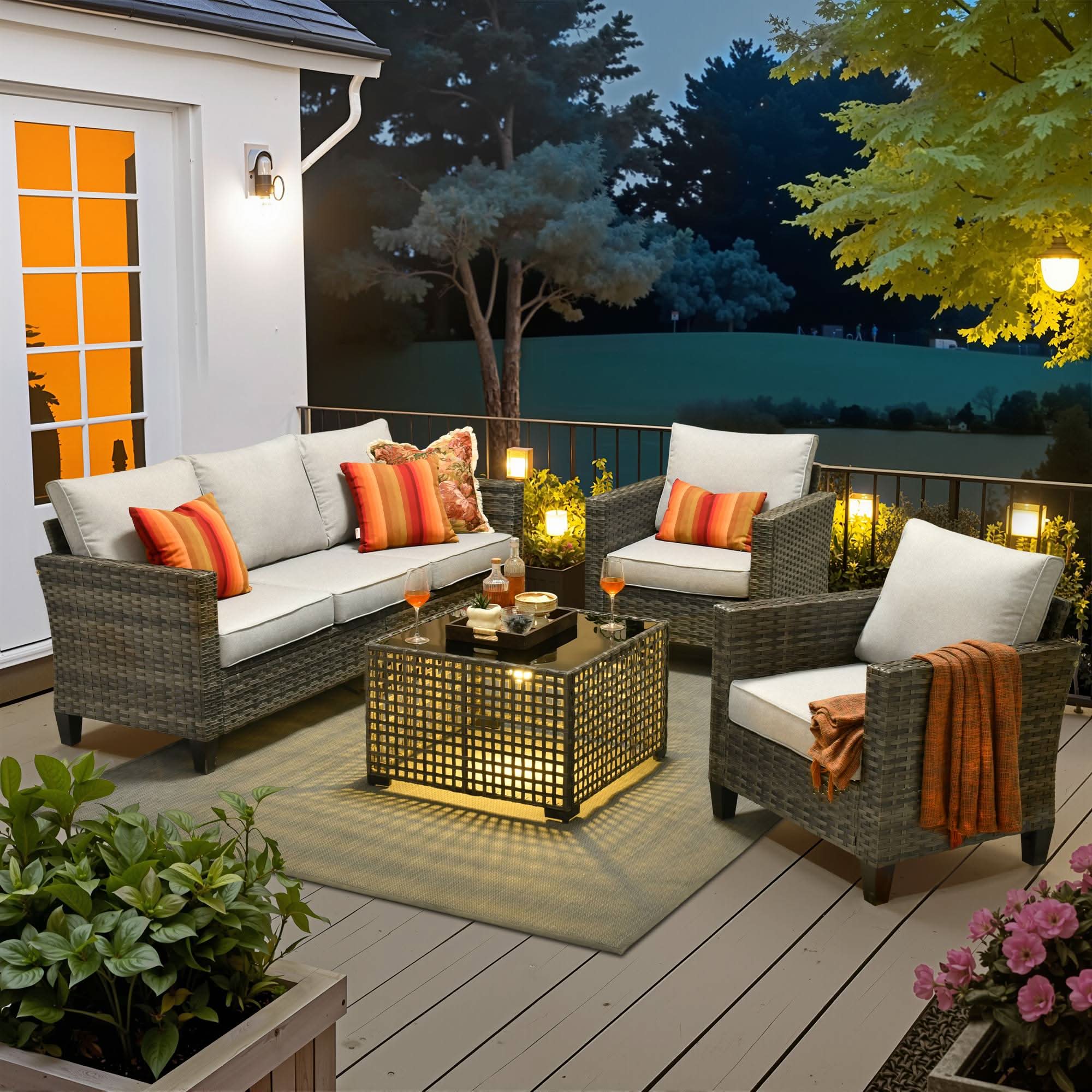 Light Grey | OVIOS 4-piece wicker patio conversation set with 3-seat sofa & solar table on deck at dusk.