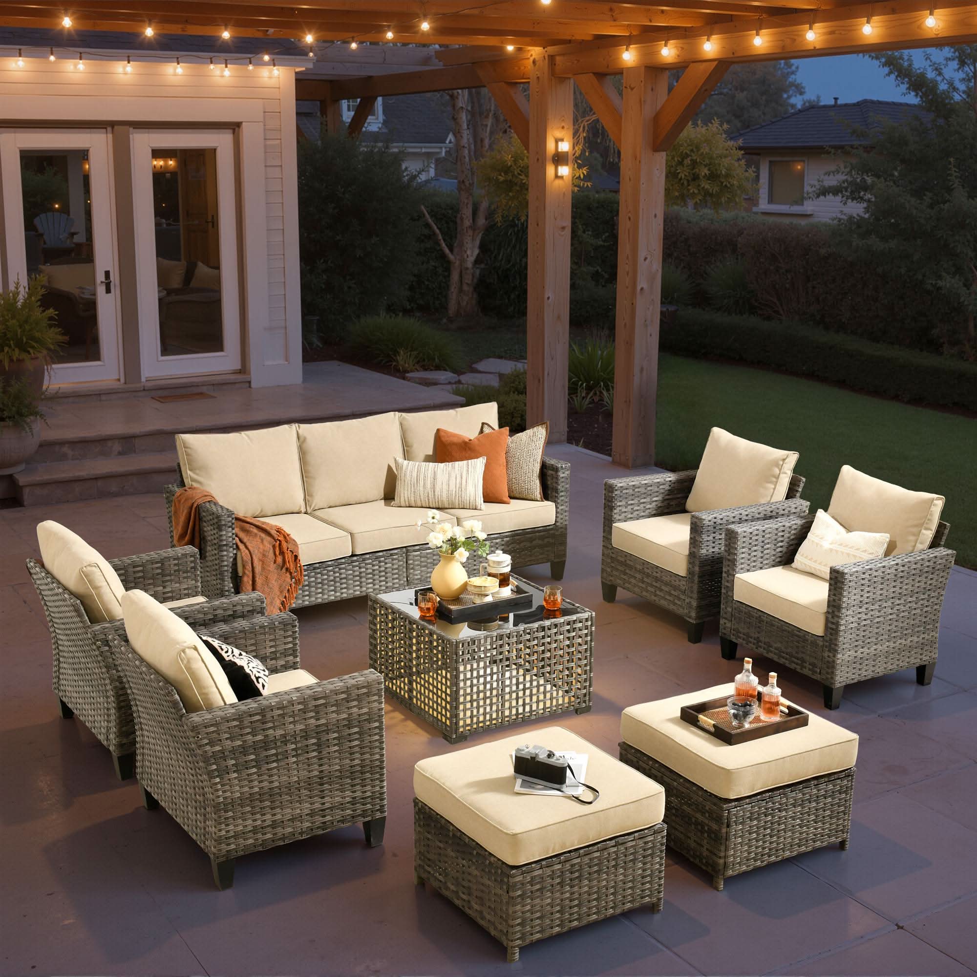 OVIOS 8-piece wicker patio conversation set with solar table, beige cushions.