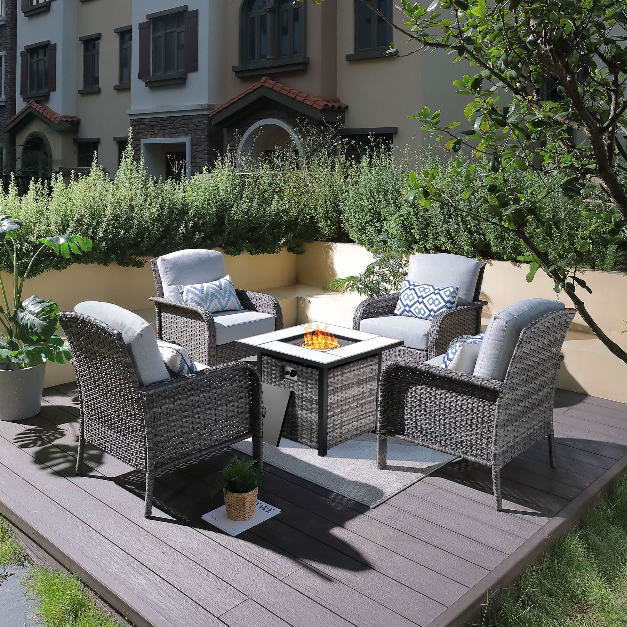 OVIOS 5-Piece Patio Set with fire pit table, grey wicker chairs, blue cushions, and flame, outdoor furniture