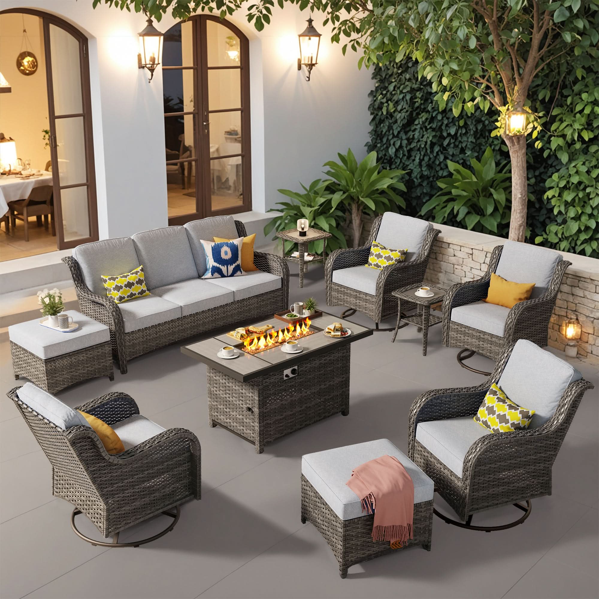 OVIOS outdoor wicker patio set with fire pit table, swivel chairs, sofa, and ottomans.