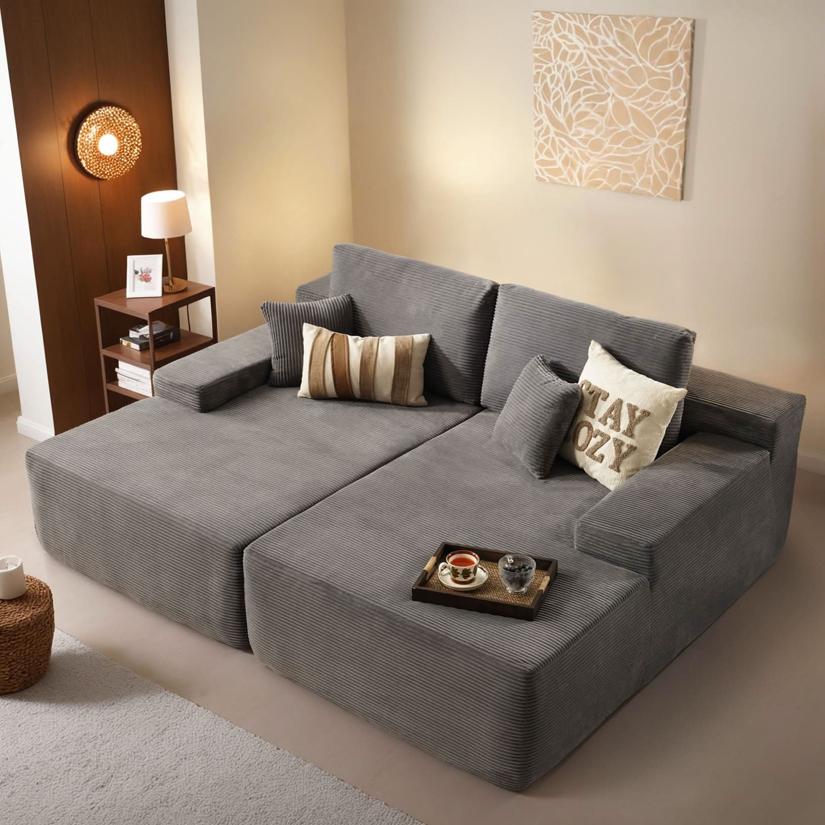 Ovios Cloud sectional sofa in gray corduroy fabric with chaise lounge, featuring STAY OZY pillow, cozy living room