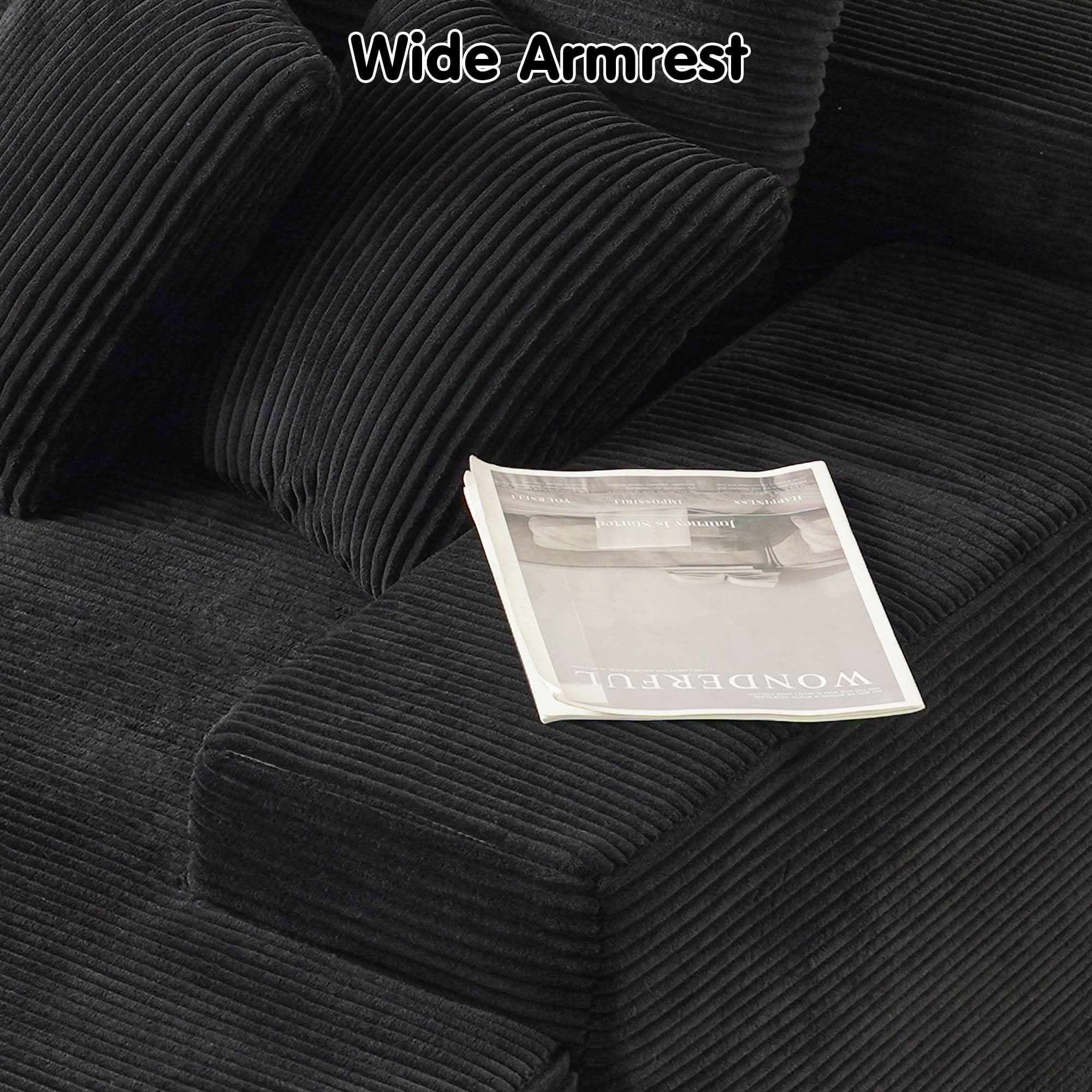 Ovios oversized sectional sofa with wide armrest, featuring black corduroy fabric and a magazine, perfect for comfort