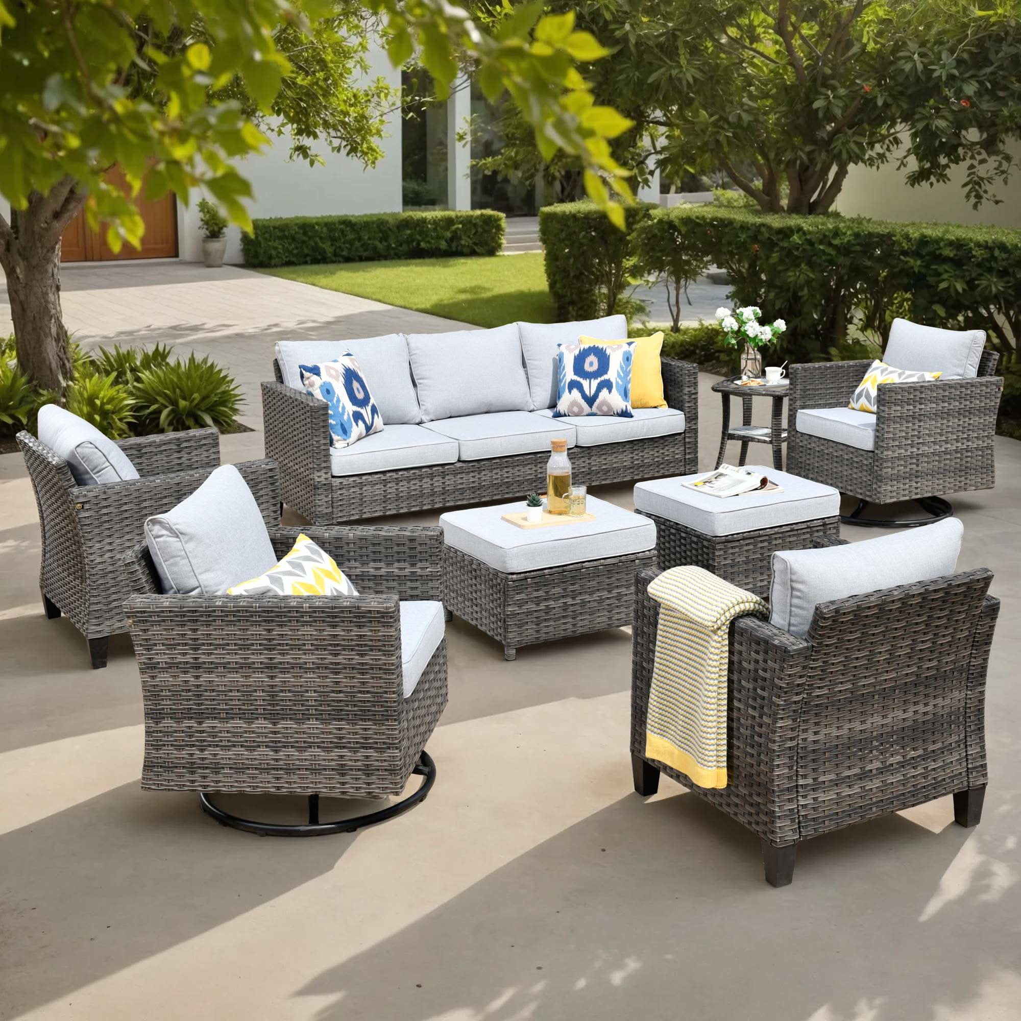 Light Grey OVIOS 8-piece grey wicker patio conversation set featuring a 3-seat sofa and swivel chairs.