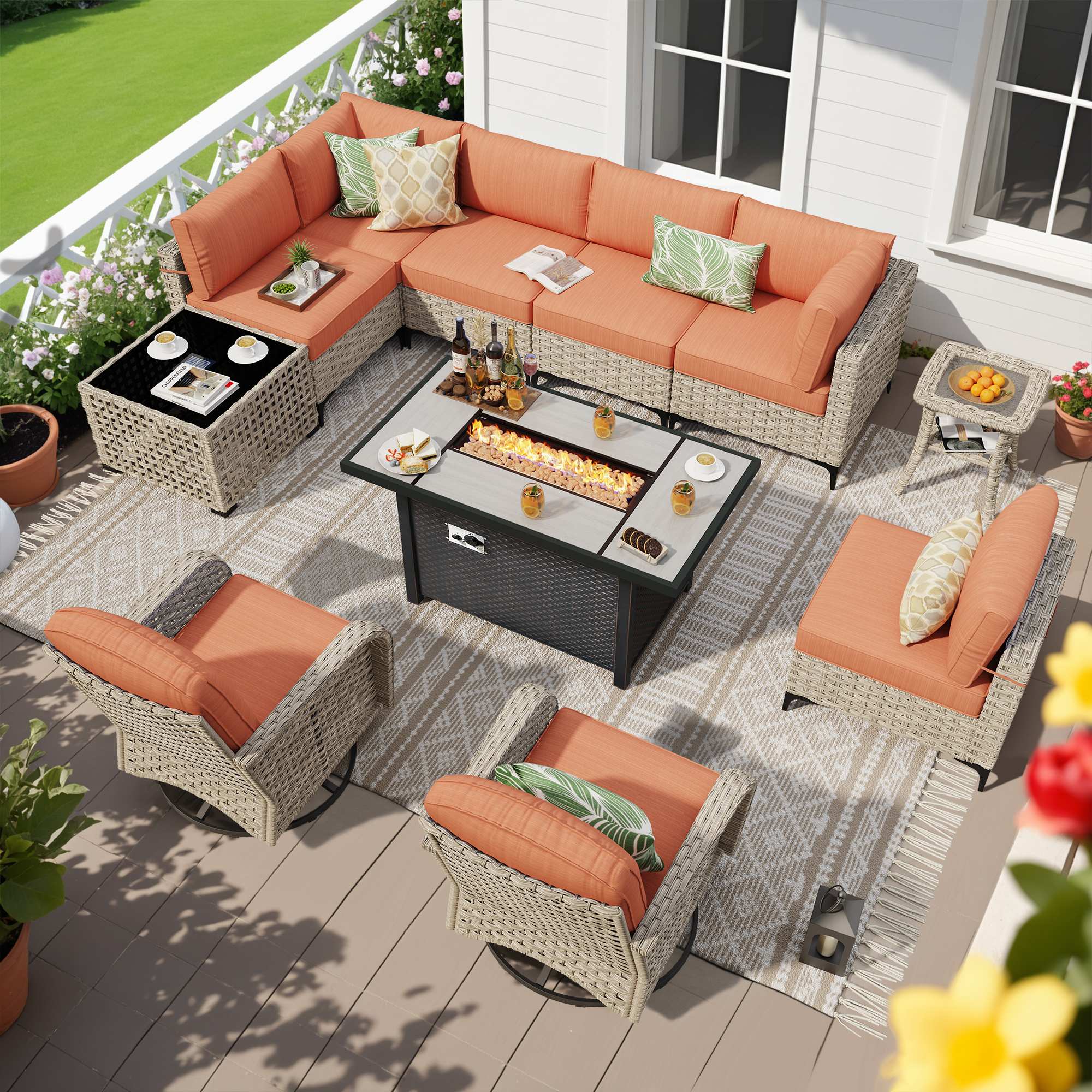 OVIOS modular wicker patio conversation set with fire pit table & orange cushions.