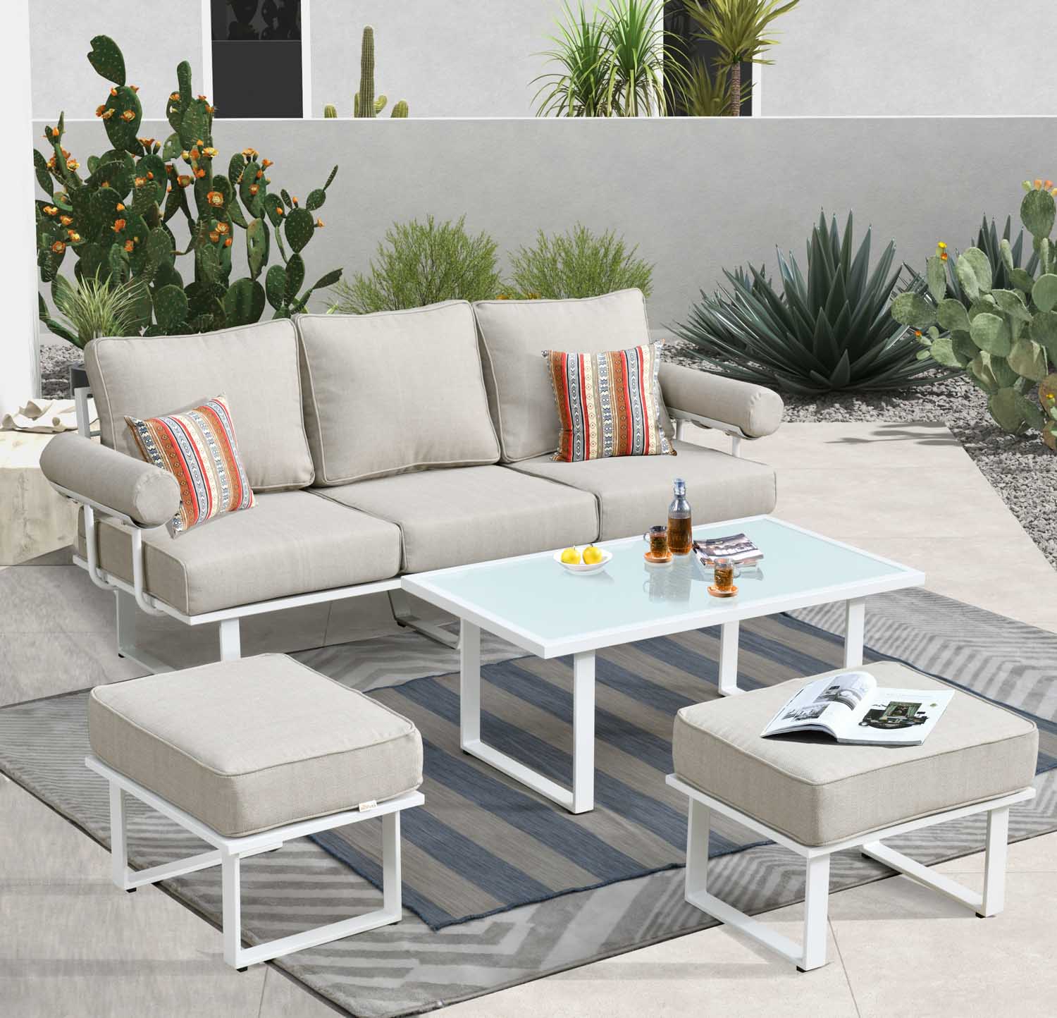 White Ovios 3-piece outdoor bistro set arranged compactly on a small balcony