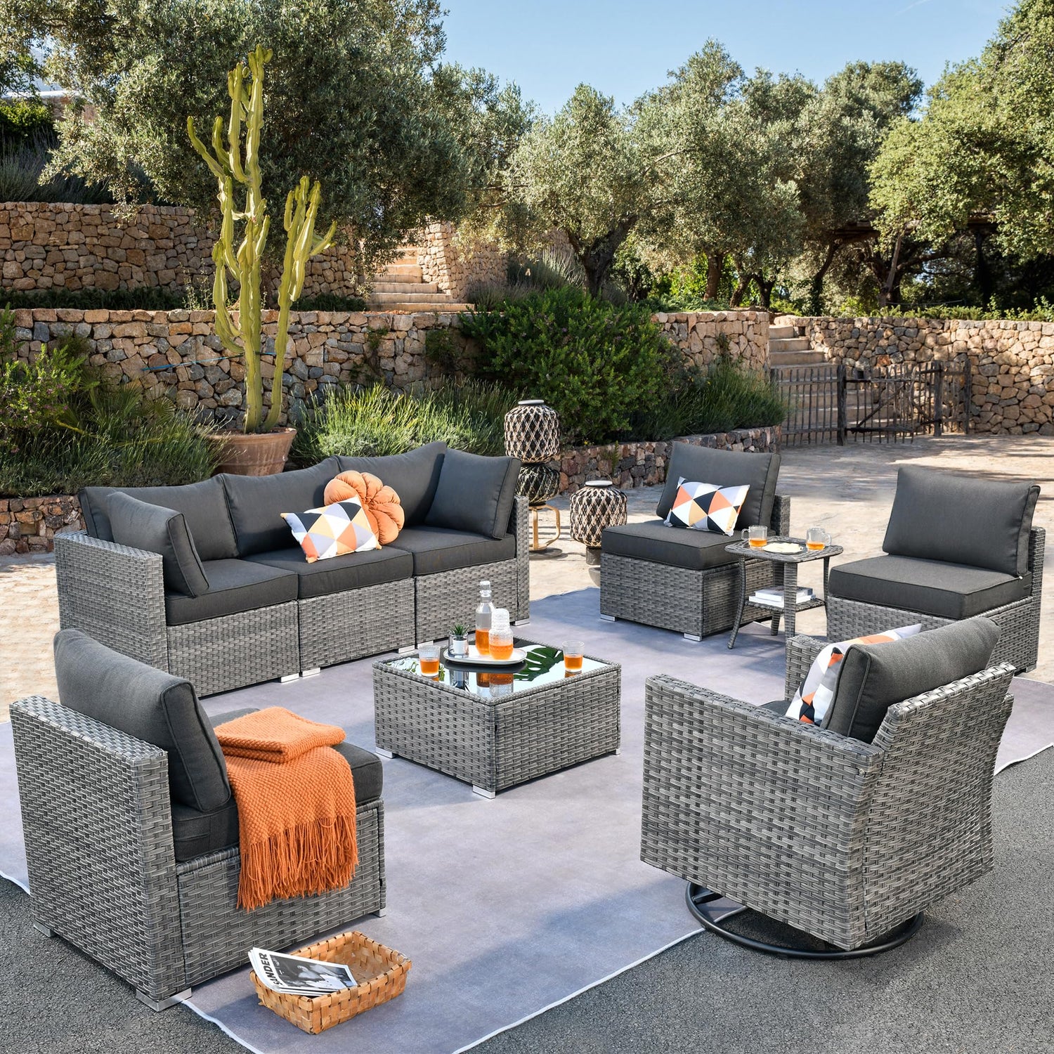 Ovios Black HOP series outdoor deep lounge chair with ergonomic reclined backrest and plush cushions set on a sunlit patio