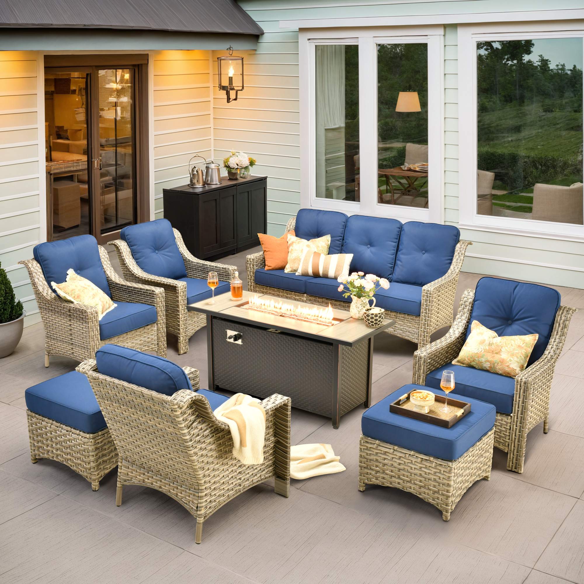 Ovios Blue Outdoor wicker conversation set with cushioned chairs arranged on a patio ready for spring entertaining