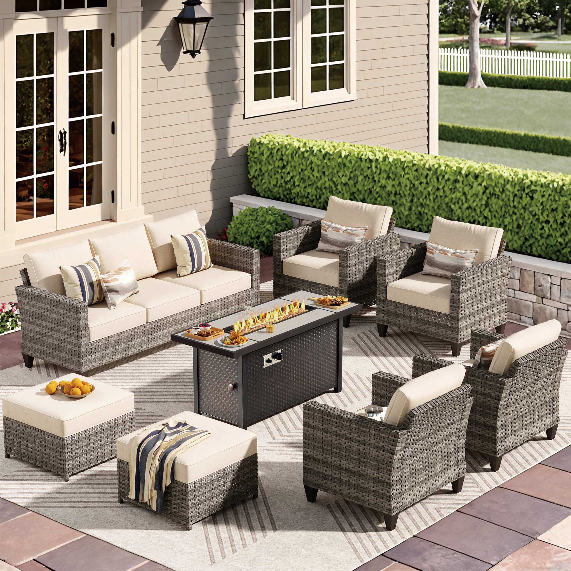 OVIOS gray wicker conversation set: lit fire pit table, sofa, 2 armchairs, 2 ottomans.