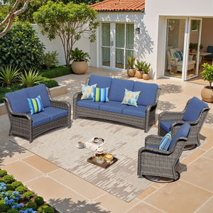 Ovios Kenard 7-piece grey wicker patio set with curved handrest & blue cushions.