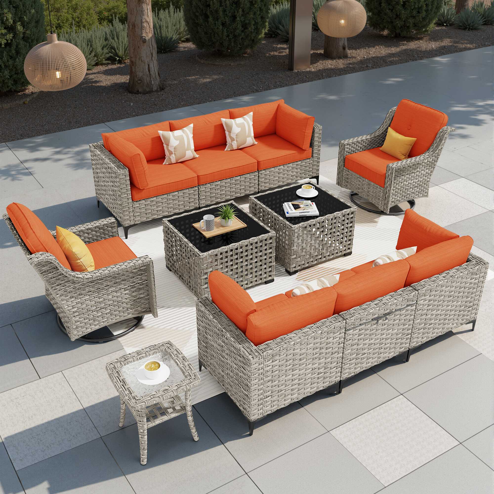 OVIOS modular outdoor wicker conversation set with orange cushions, glass tables.