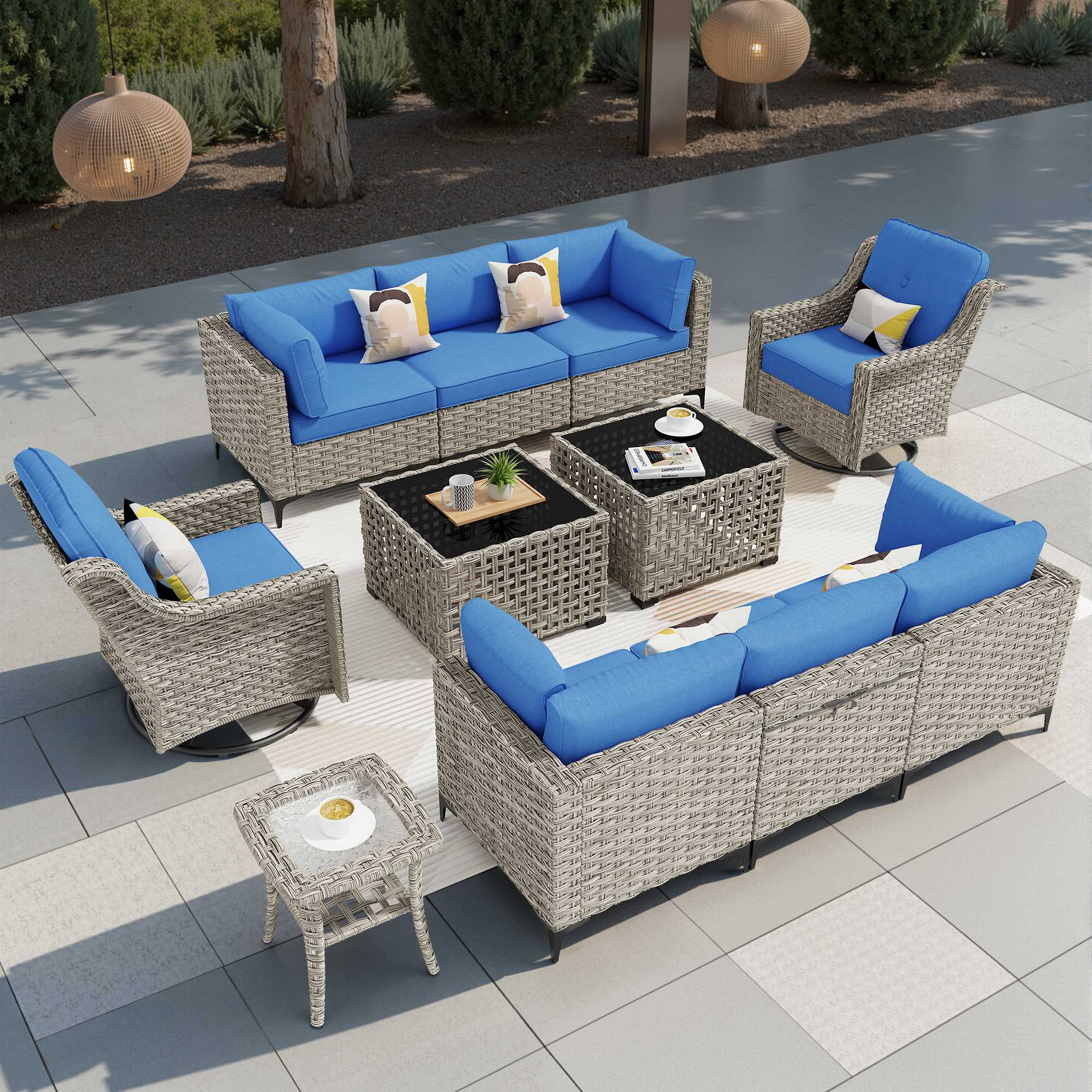 OVIOS modular outdoor wicker conversation set in grey with blue cushions, featuring a swivel chair and solar light table.